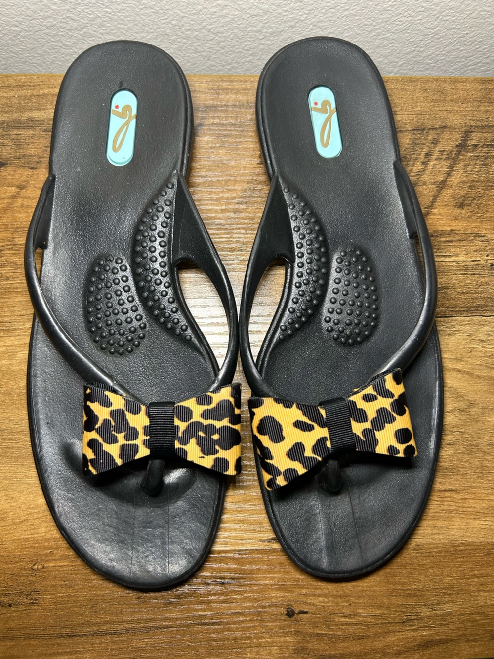 OKA b. Black Flip-Flop Sandals with Leopard Bow Accent